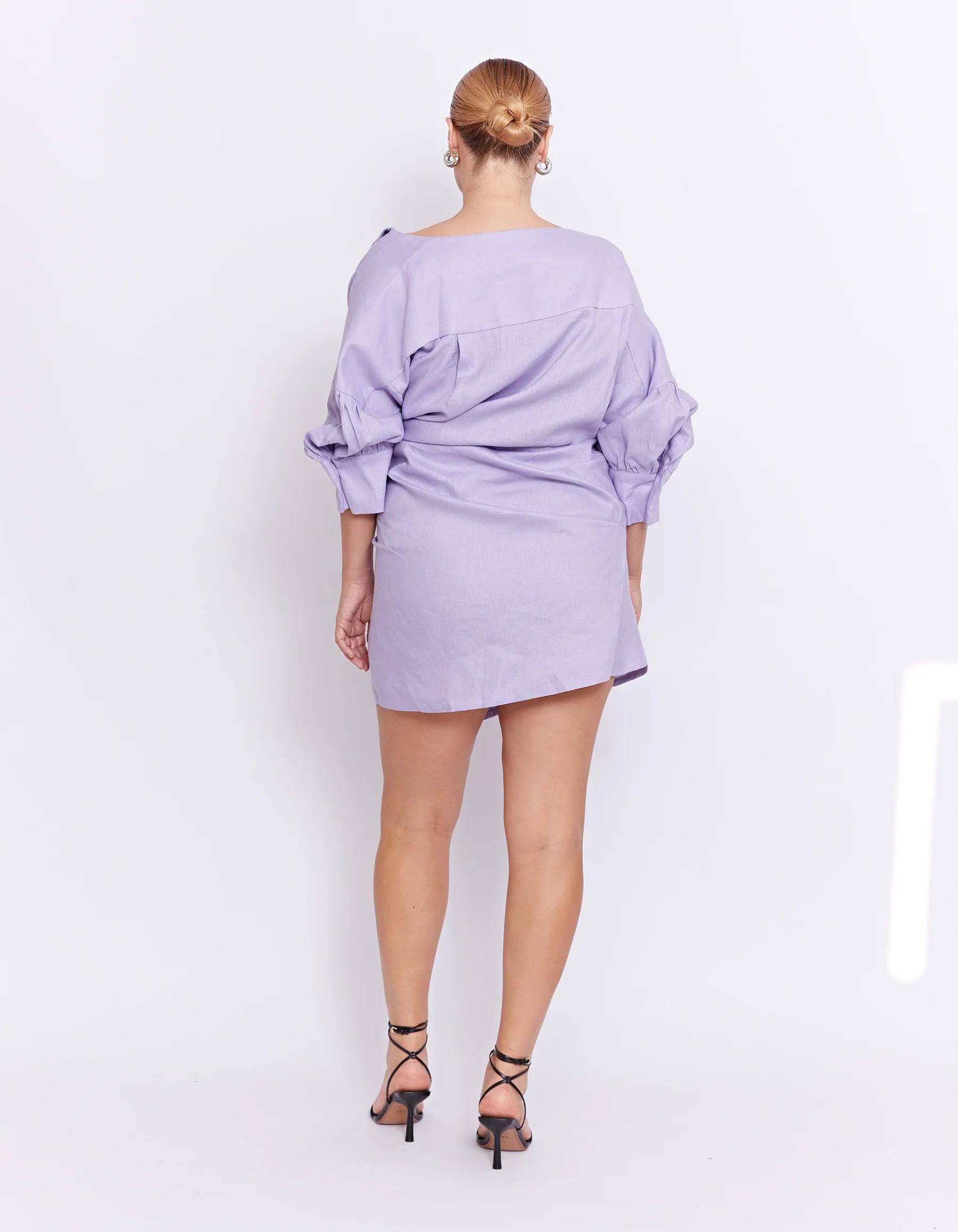 back of a purple mini dress with long sleeves 