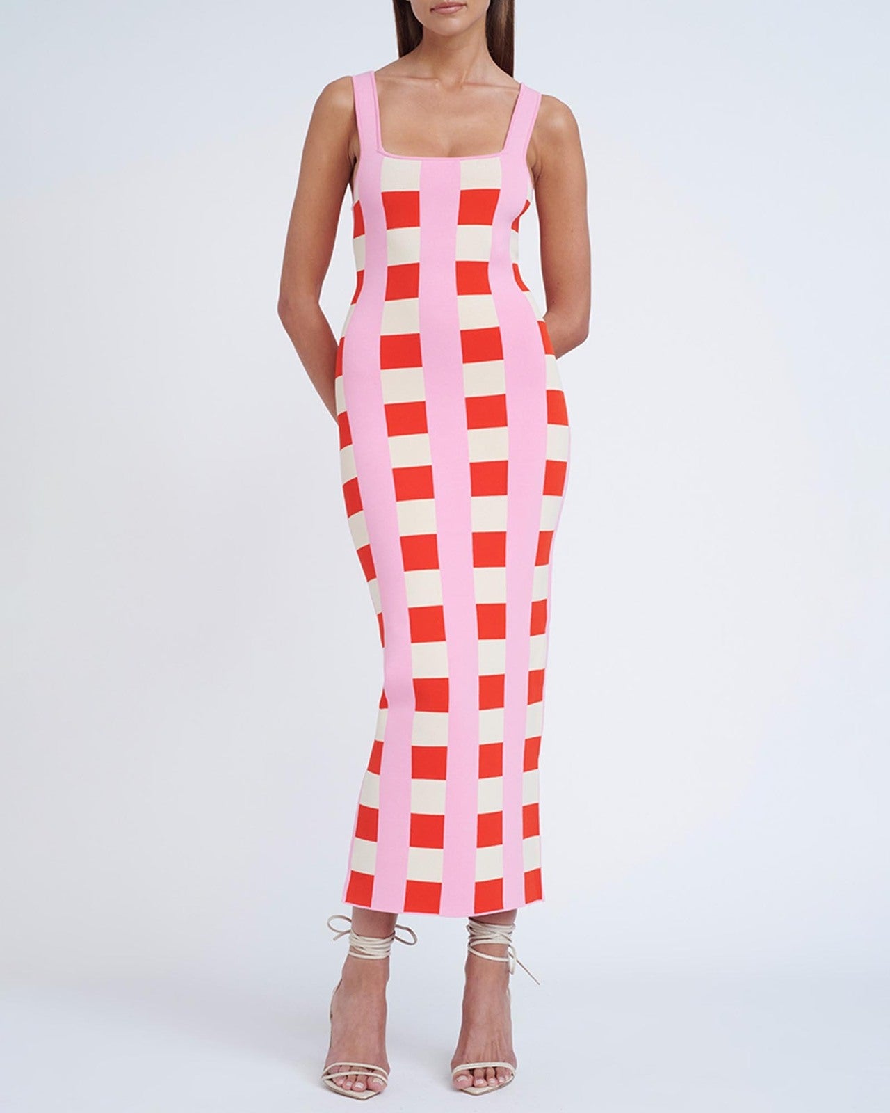 women in a pink and red checkered dress