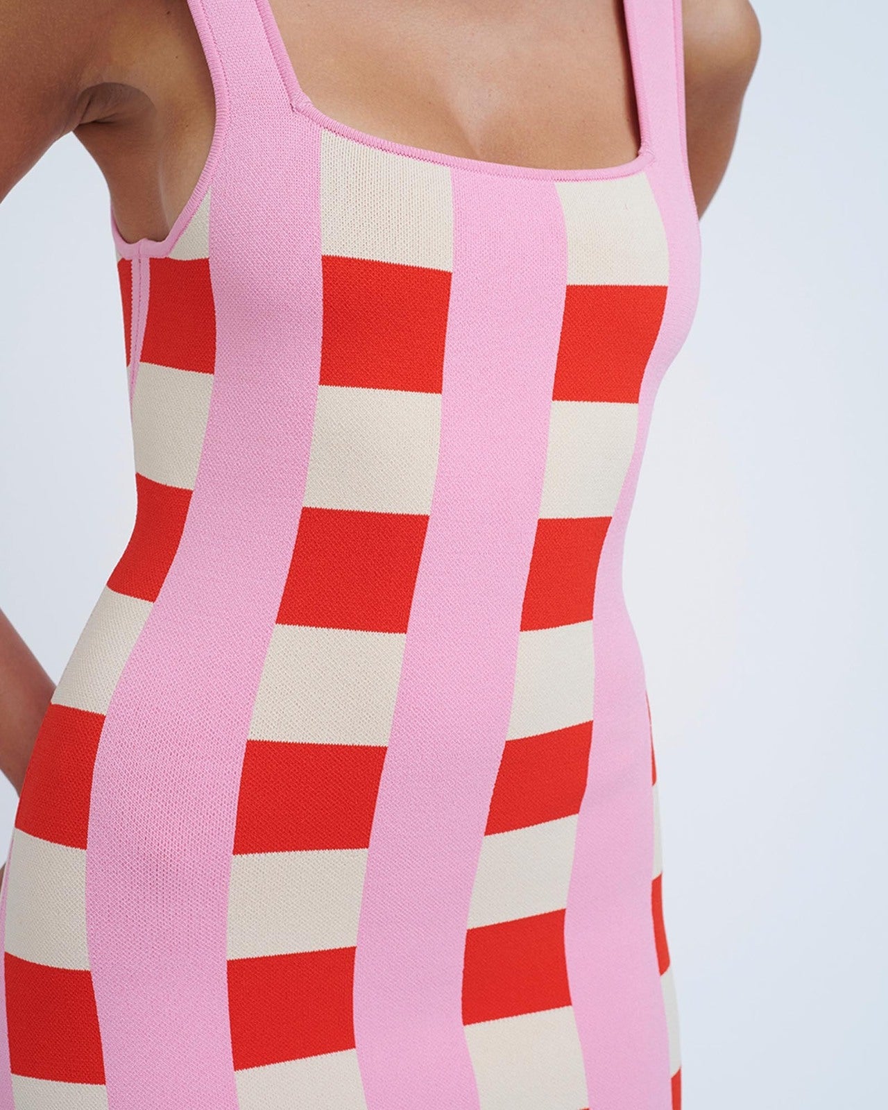 close up of a pink and red checkered dress