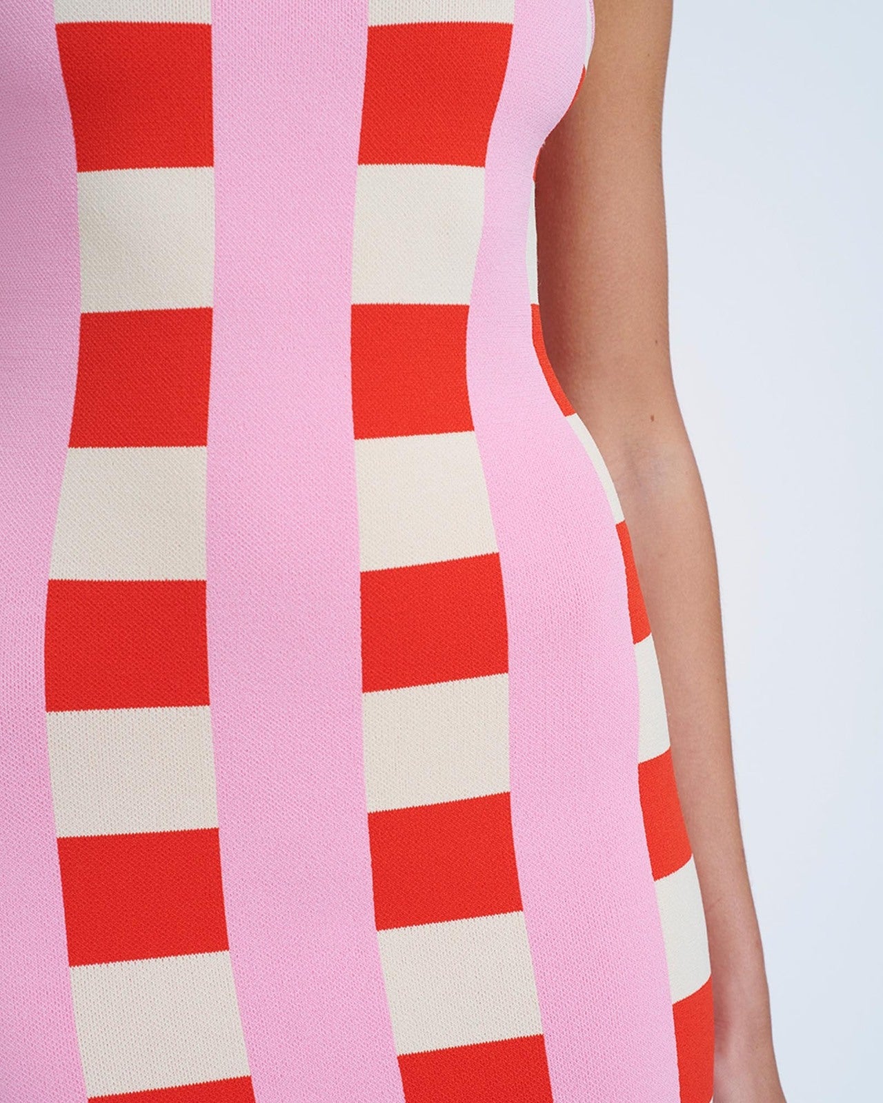 close up of a pink and red checkered dress